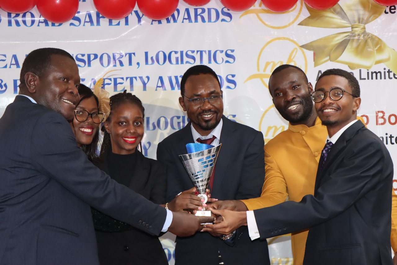 Winners Receiving Awards Trophy From H.E Kalonzo Musyoka